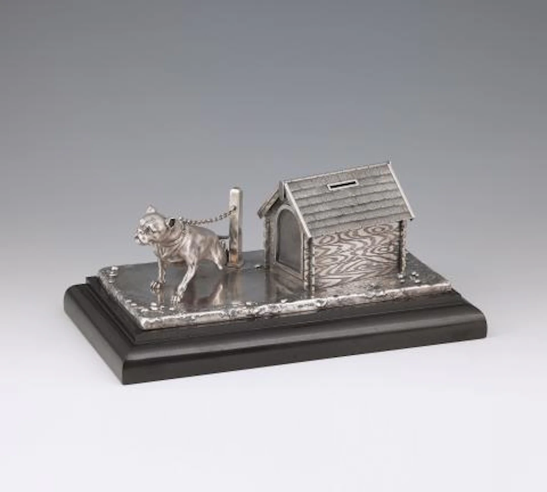 A St. Petersburg silver money box in the form of a Dog House with a watchdog