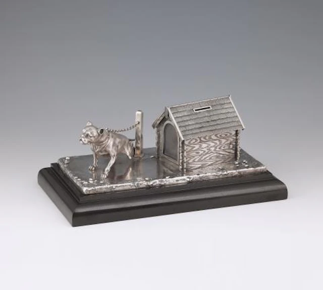 A St. Petersburg silver money box in the form of a Dog House with a watchdog