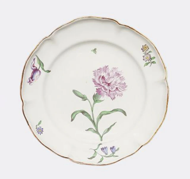 A Strasbourg faience plate with a large carnation flower