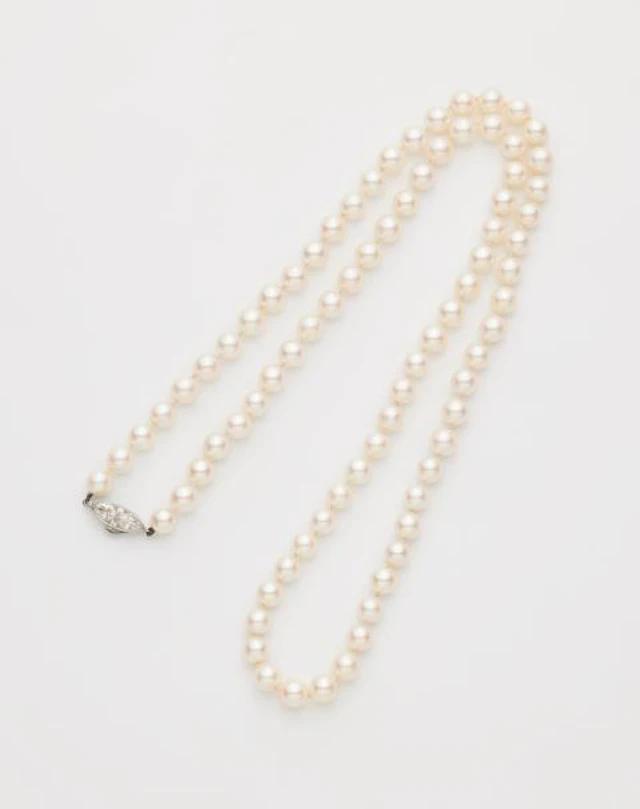 A custom made cultured pearl necklace using a platinum diamond Belle