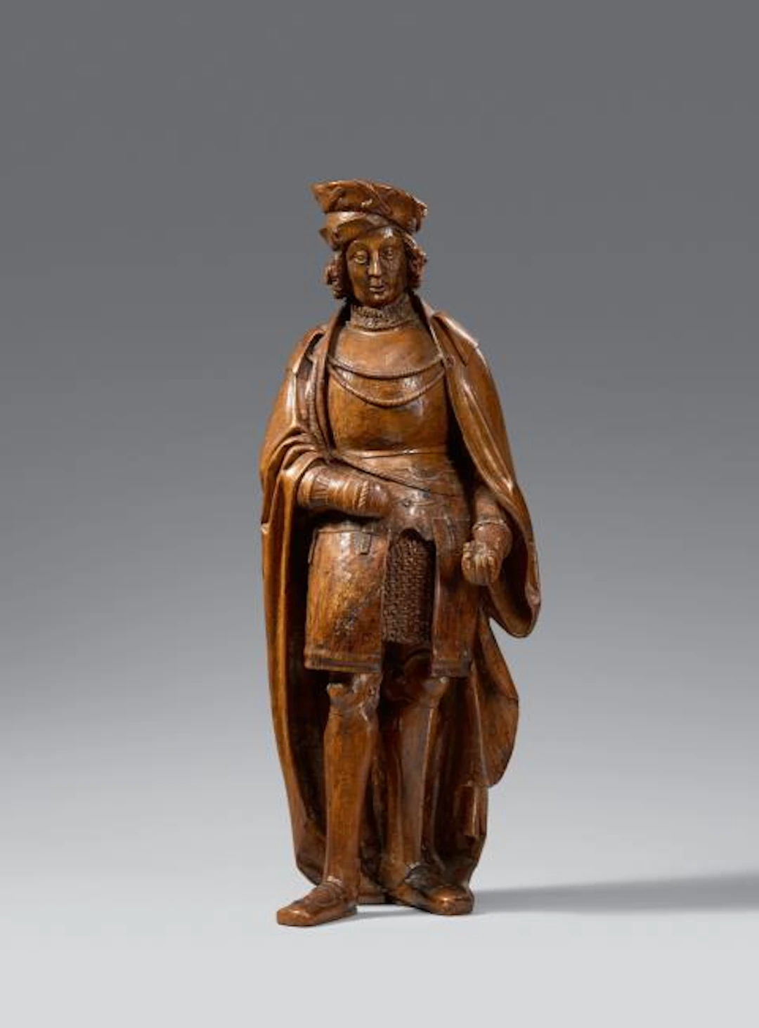 A carved oak figure of a saint