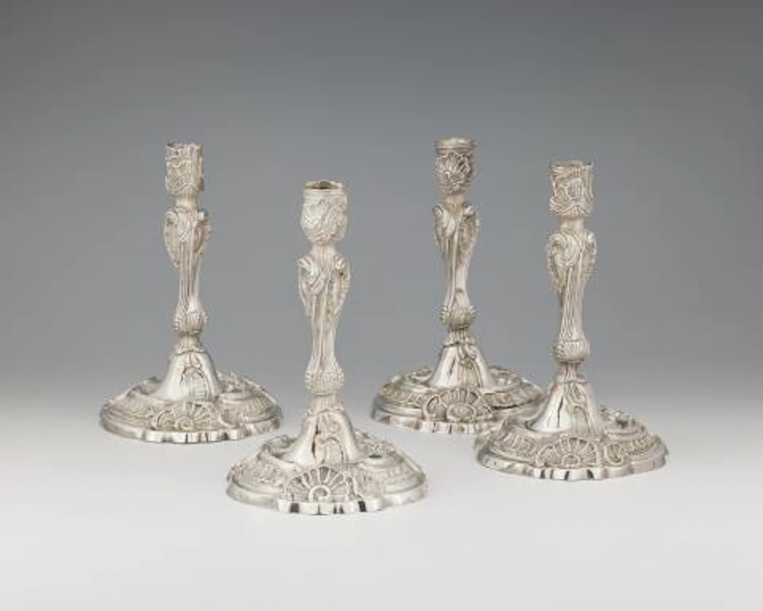 A set of four Augsburg Rococo silver candlesticks