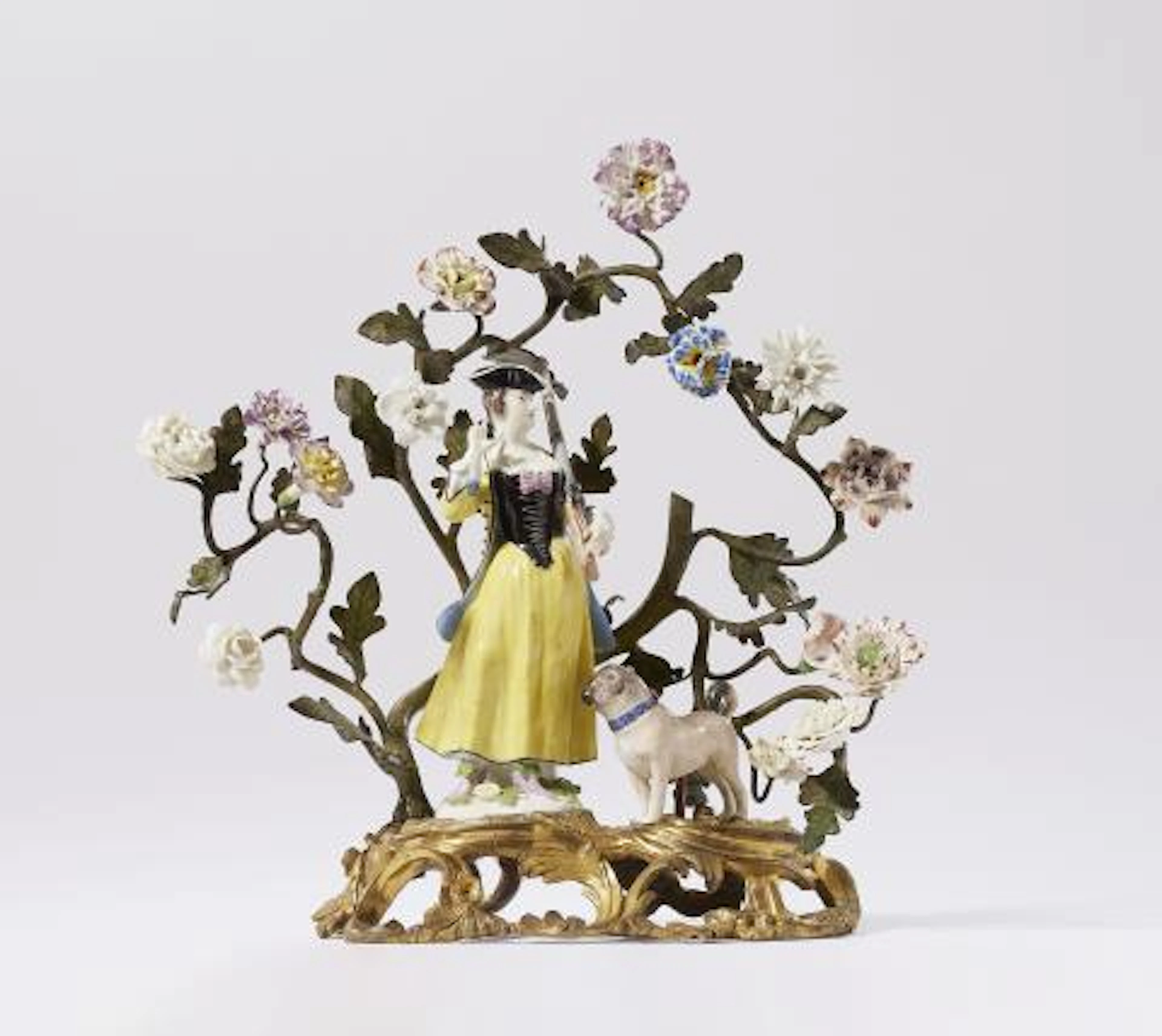 Meissen porcelain figure of a huntress and a pug dog in ormolu mounts