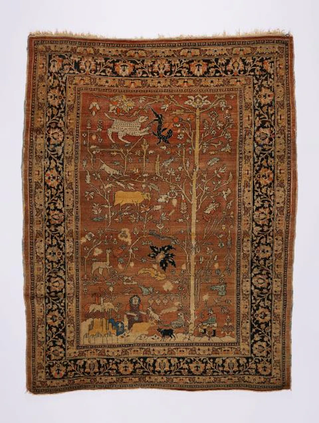 A Tabriz carpet with a hunting scene and tree of life motif