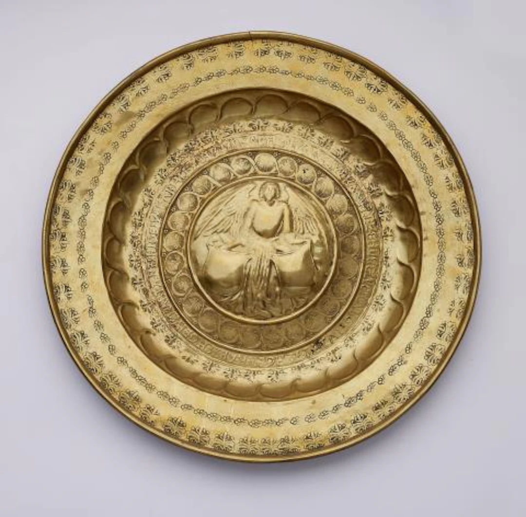 A brass 'Beckenschlägerschüssel' with an angel holding a shield