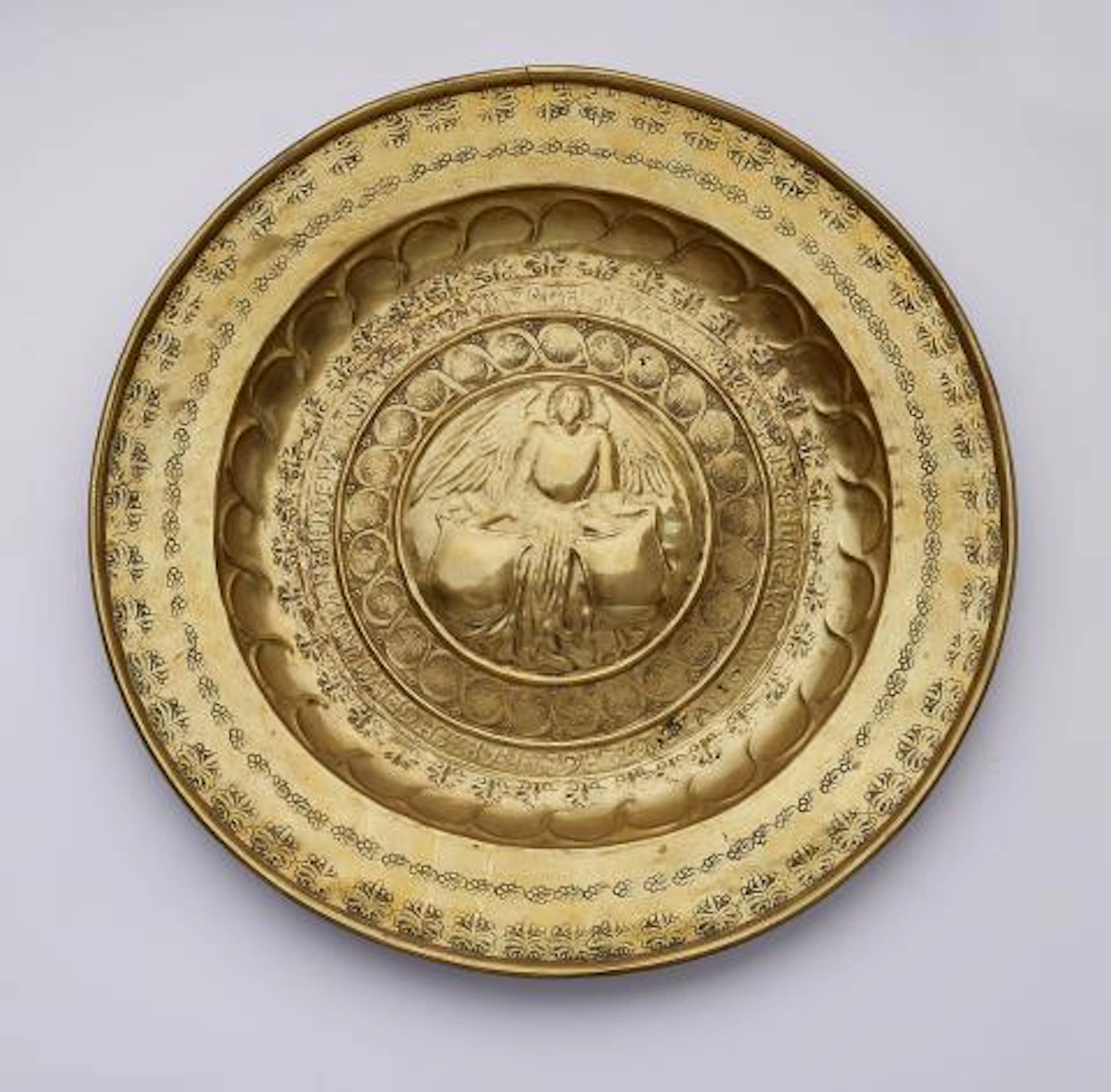 A brass 'Beckenschlägerschüssel' with an angel holding a shield