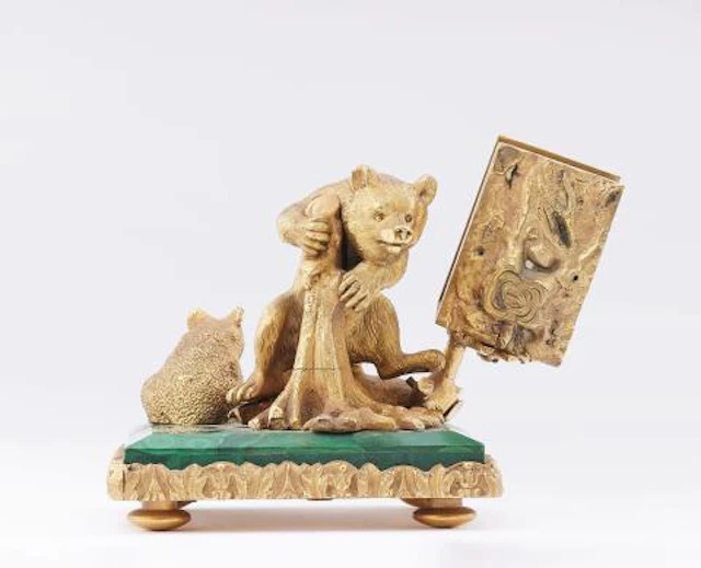 A bronze bear group with a holder for matches or cards
