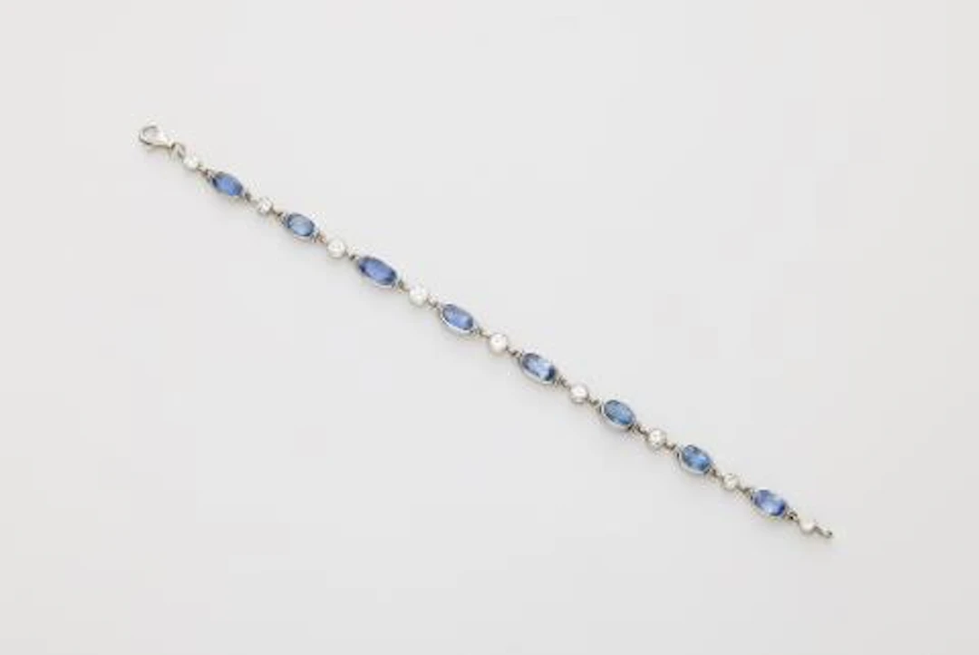 An 18k white gold diamond and sapphire bracelet.