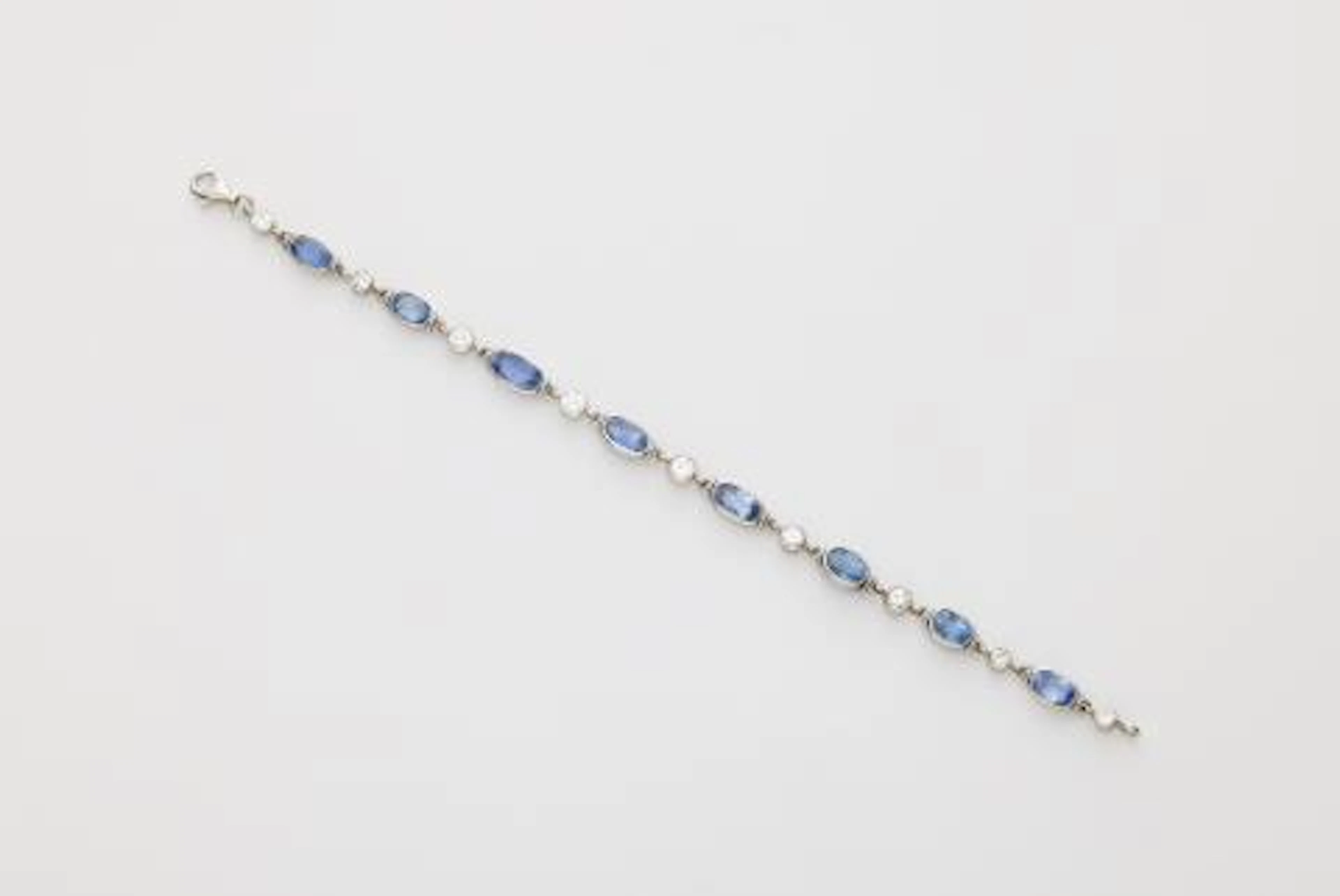 An 18k white gold diamond and sapphire bracelet.