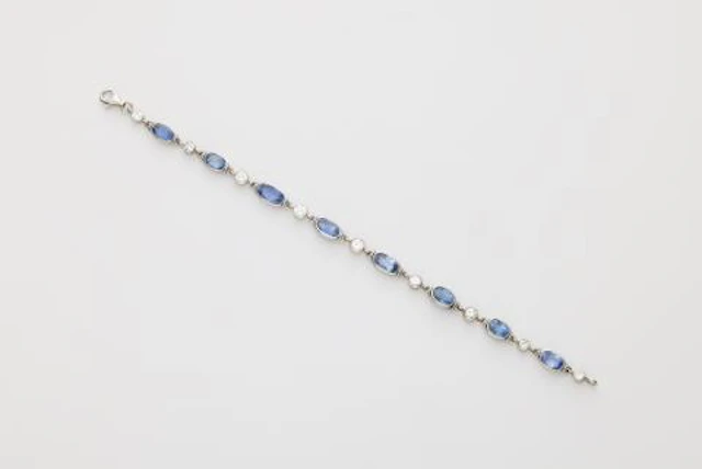 An 18k white gold diamond and sapphire bracelet.