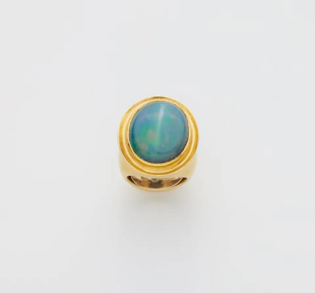 A German forged 18k gold and opal ring.