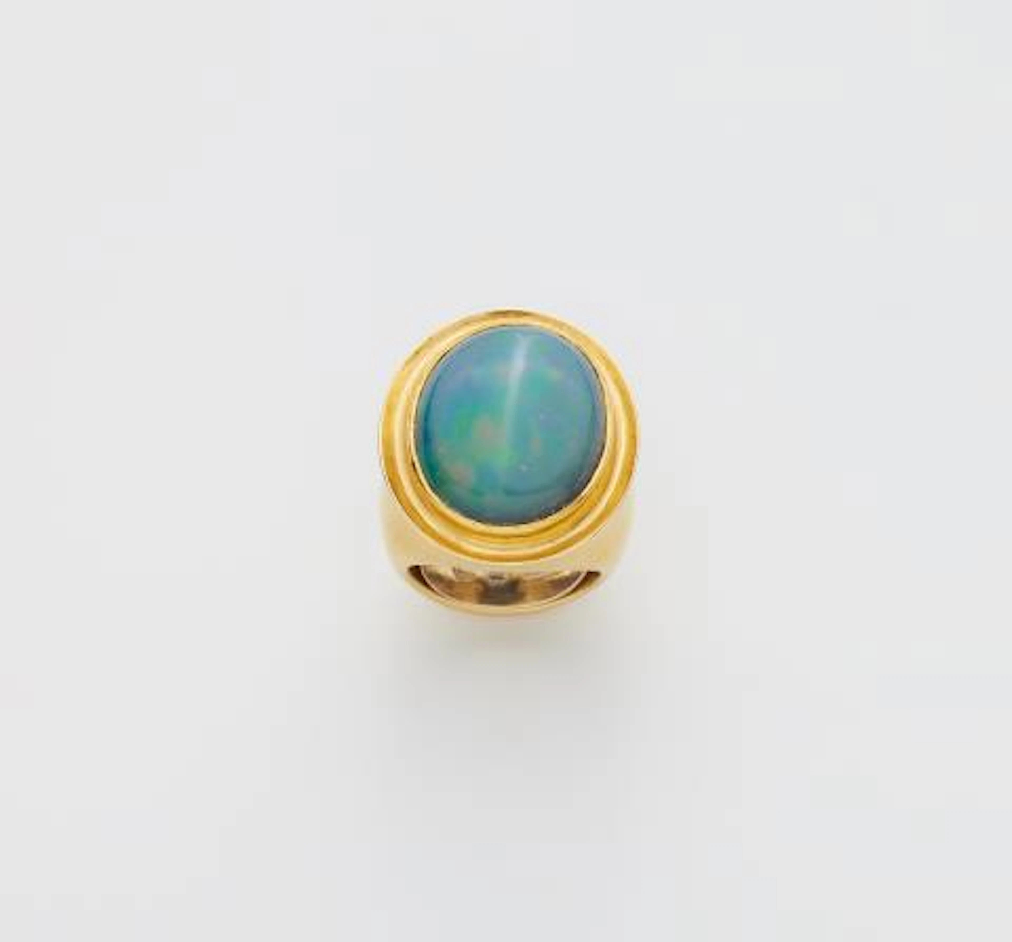 A German forged 18k gold and opal ring.