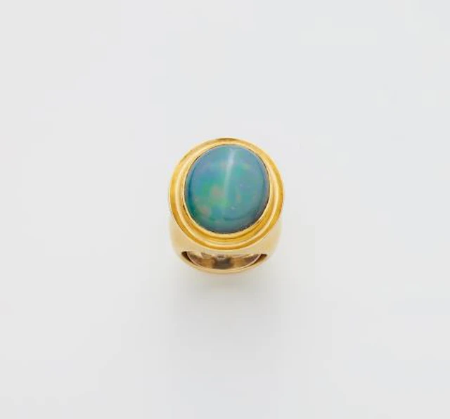 A German forged 18k gold and opal ring.