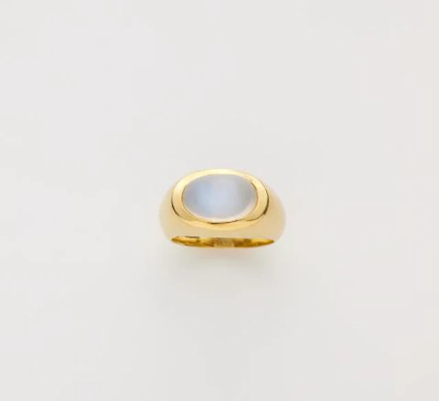 A German 18k gold and moonstone cabochon band ring.