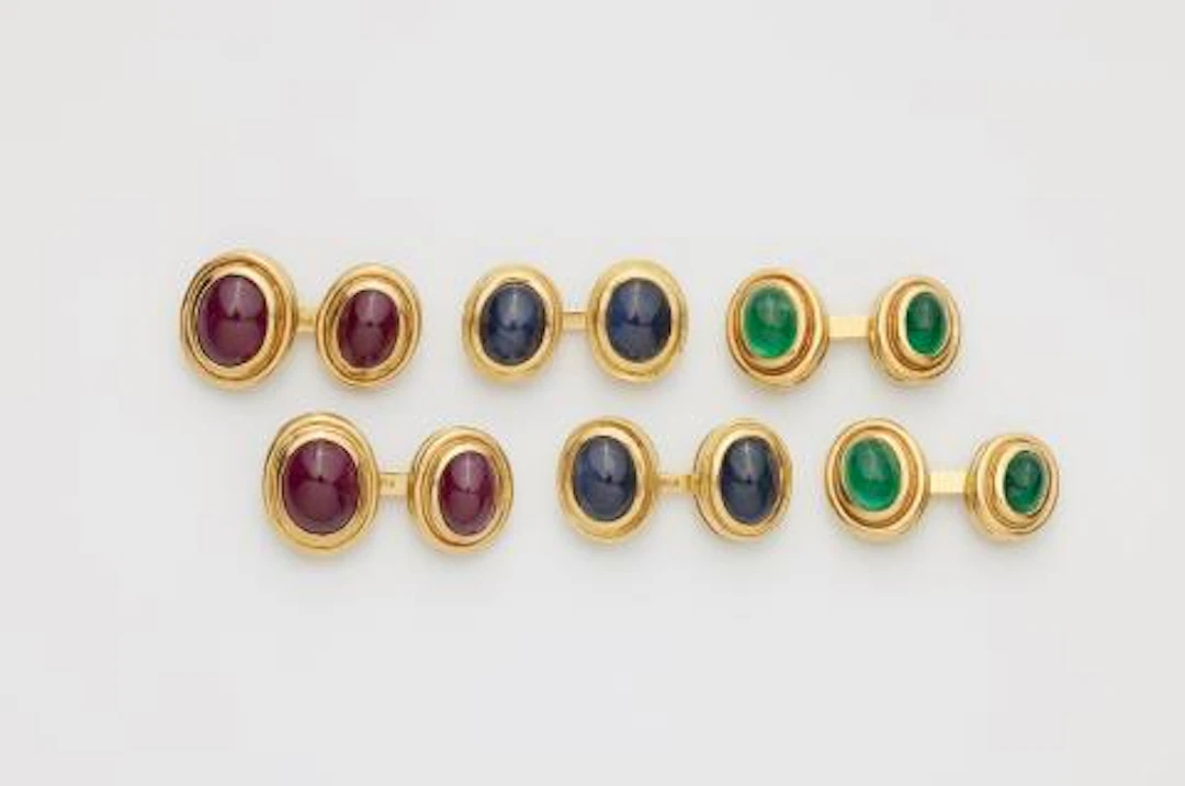 A set of three pairs of 18k yellow gold and coloured gemstone cabochon