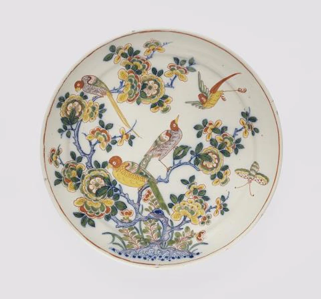 A Dutch Delft faience plate with Chinoiserie decor