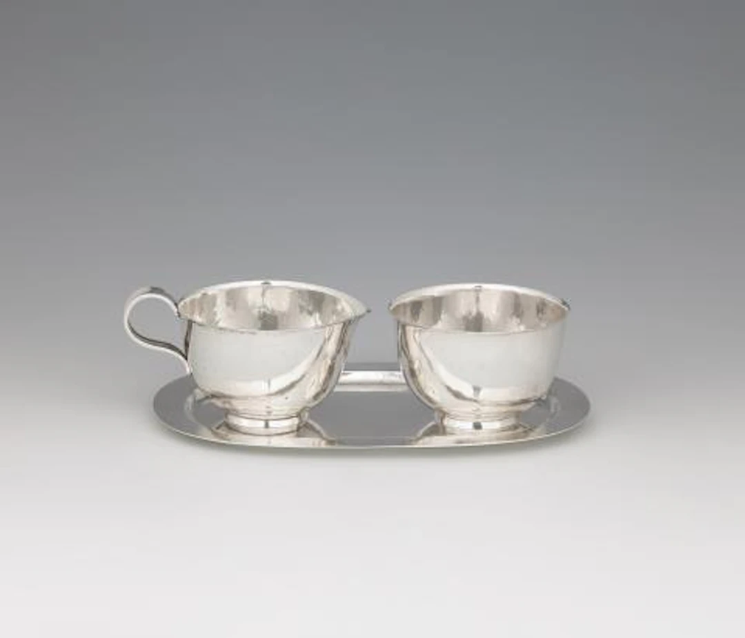 A rare silver cream set by Robert Fischer