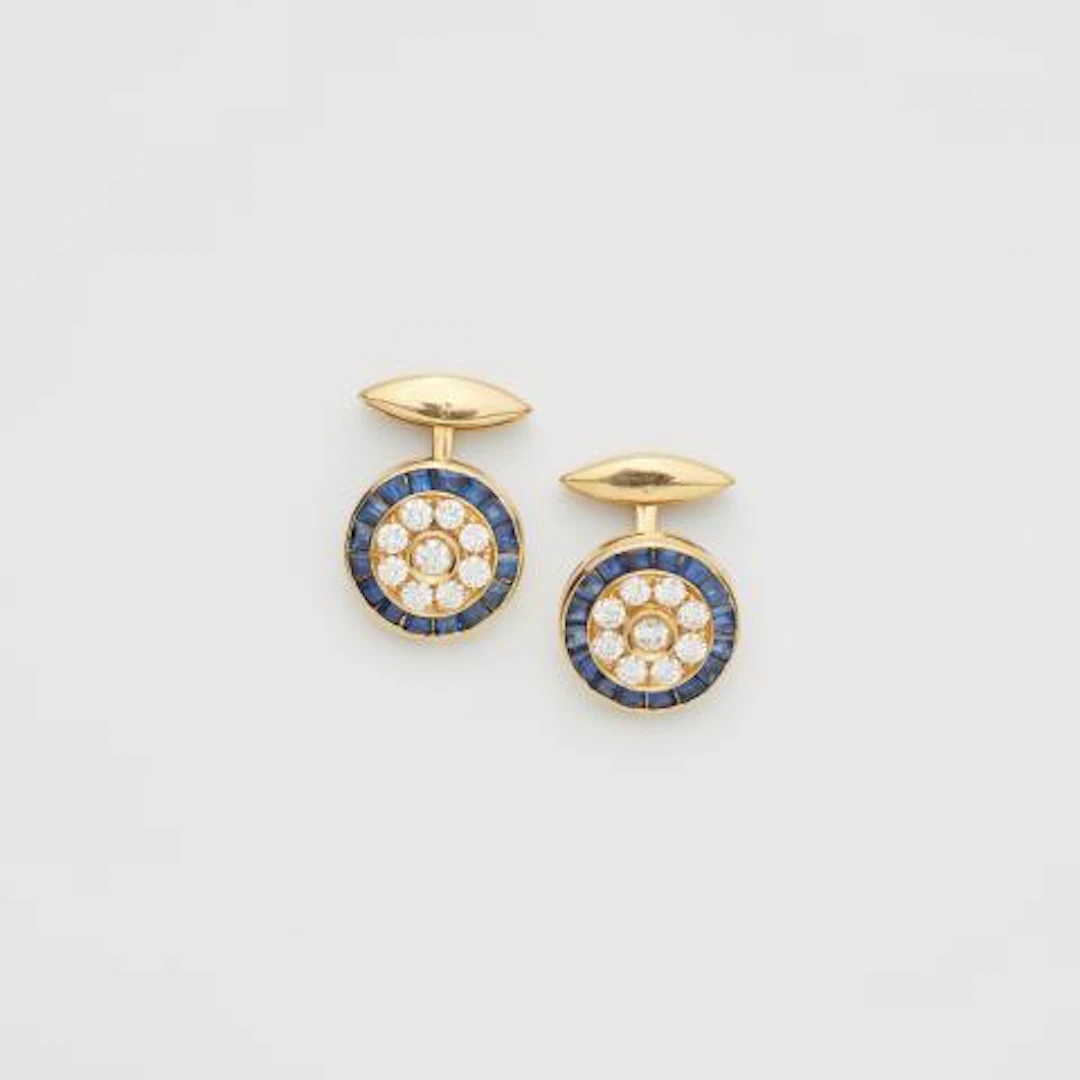 A pair of 18k yellow gold diamond and sapphire cufflinks.