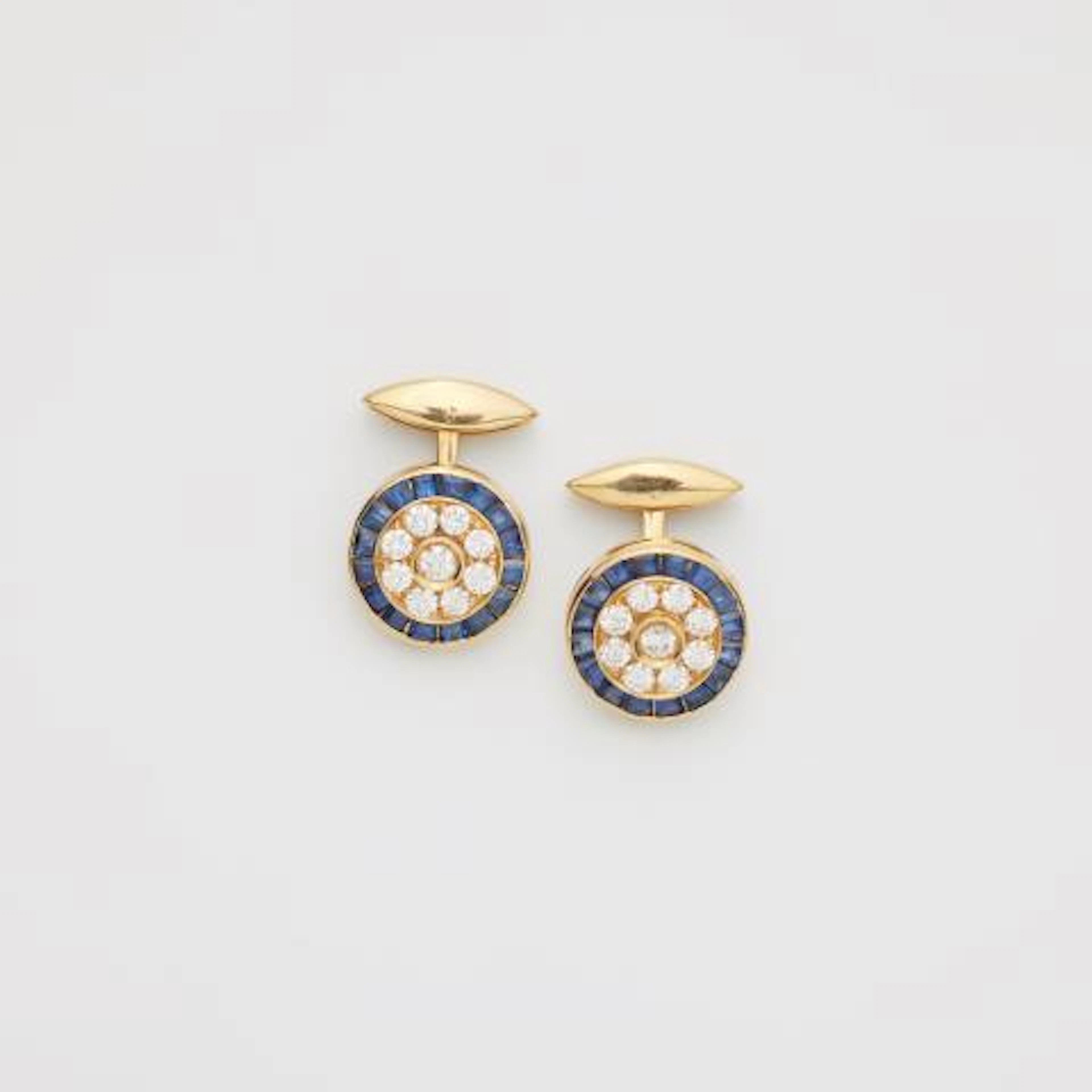 A pair of 18k yellow gold diamond and sapphire cufflinks.