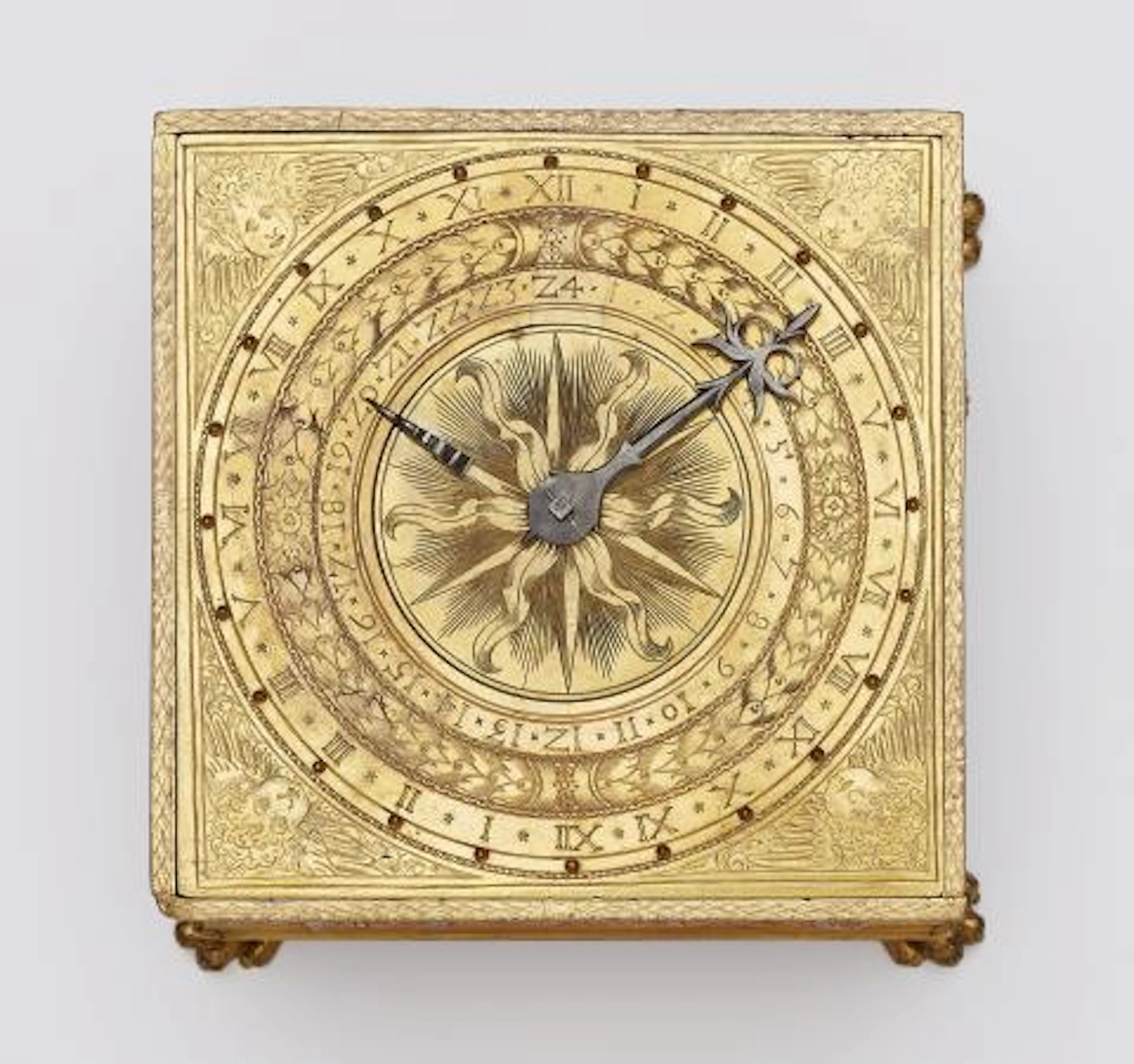 A table clock with continuous relief depicting the story of Adam and Eve