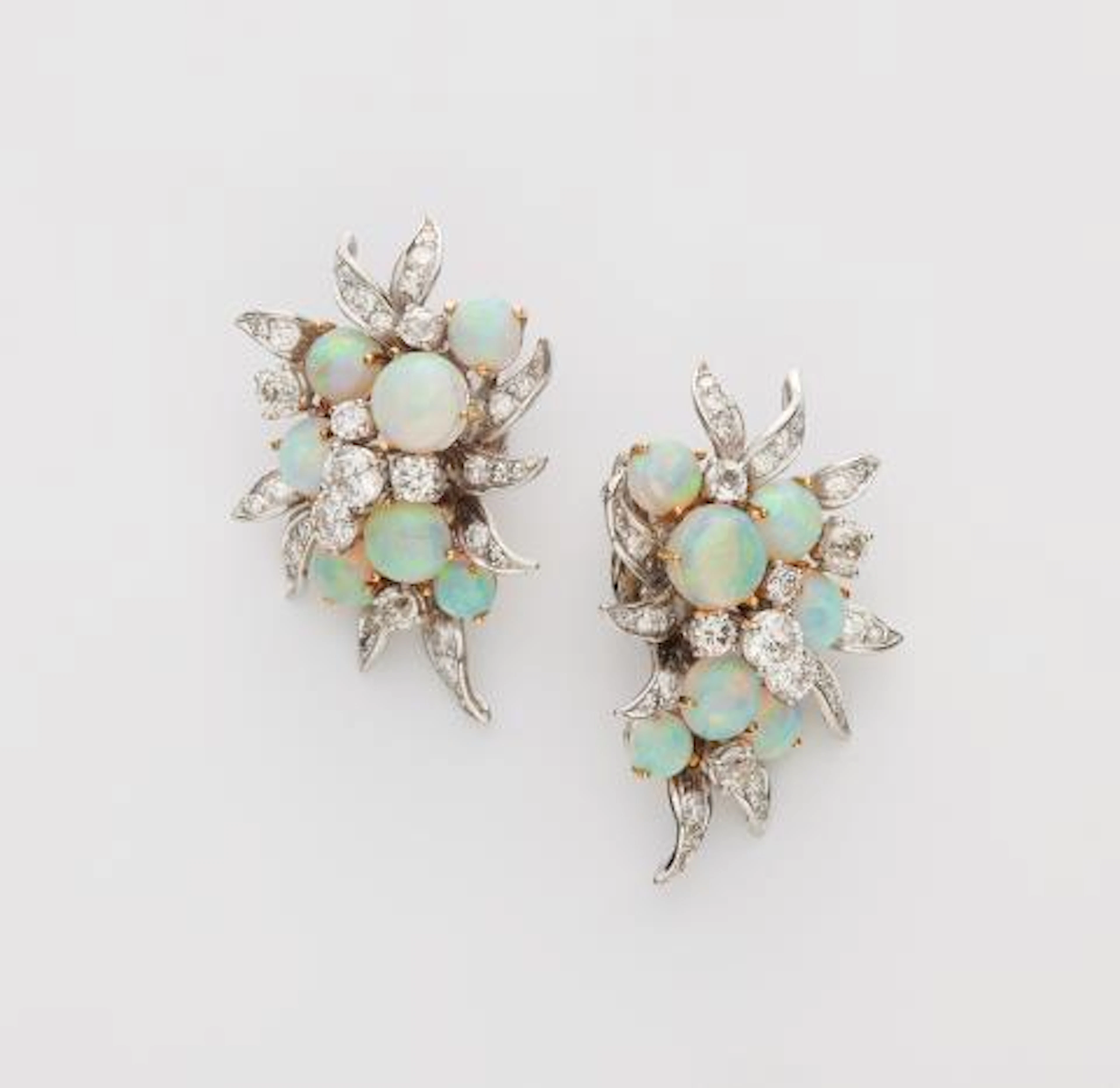 A pair of 18k white and yellow gold, diamond and opal cocktail clip earrings.