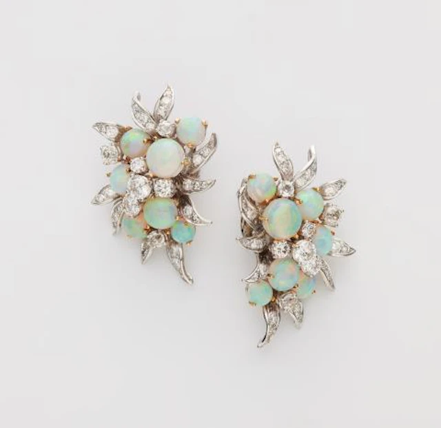A pair of 18k white and yellow gold, diamond and opal cocktail clip earrings.