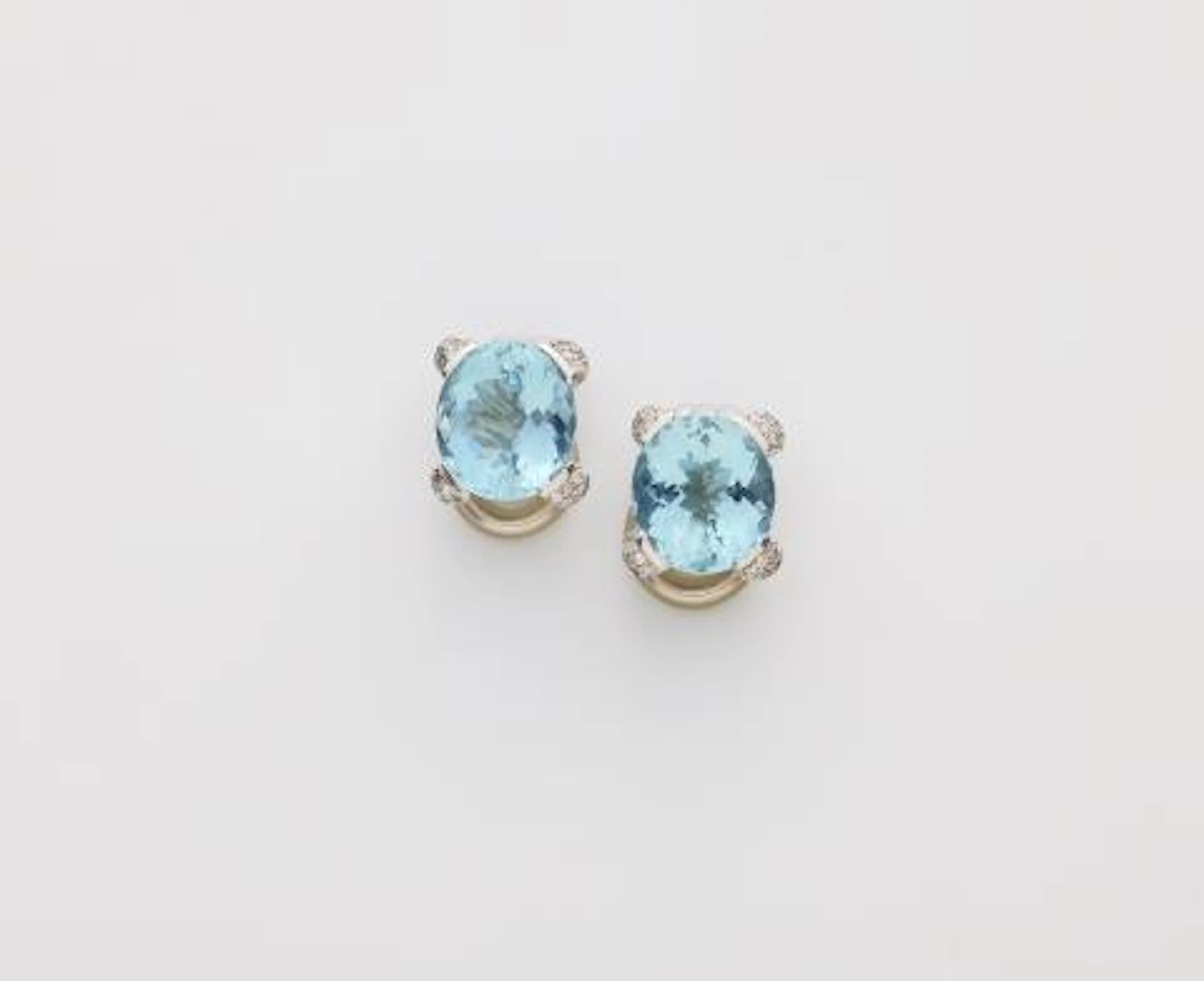A pair of 18k white gold diamond and aquamarine clip earrings.