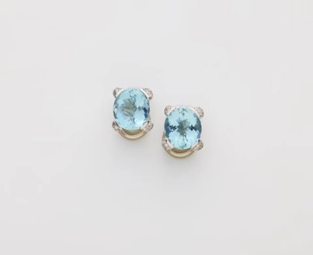 A pair of 18k white gold diamond and aquamarine clip earrings.