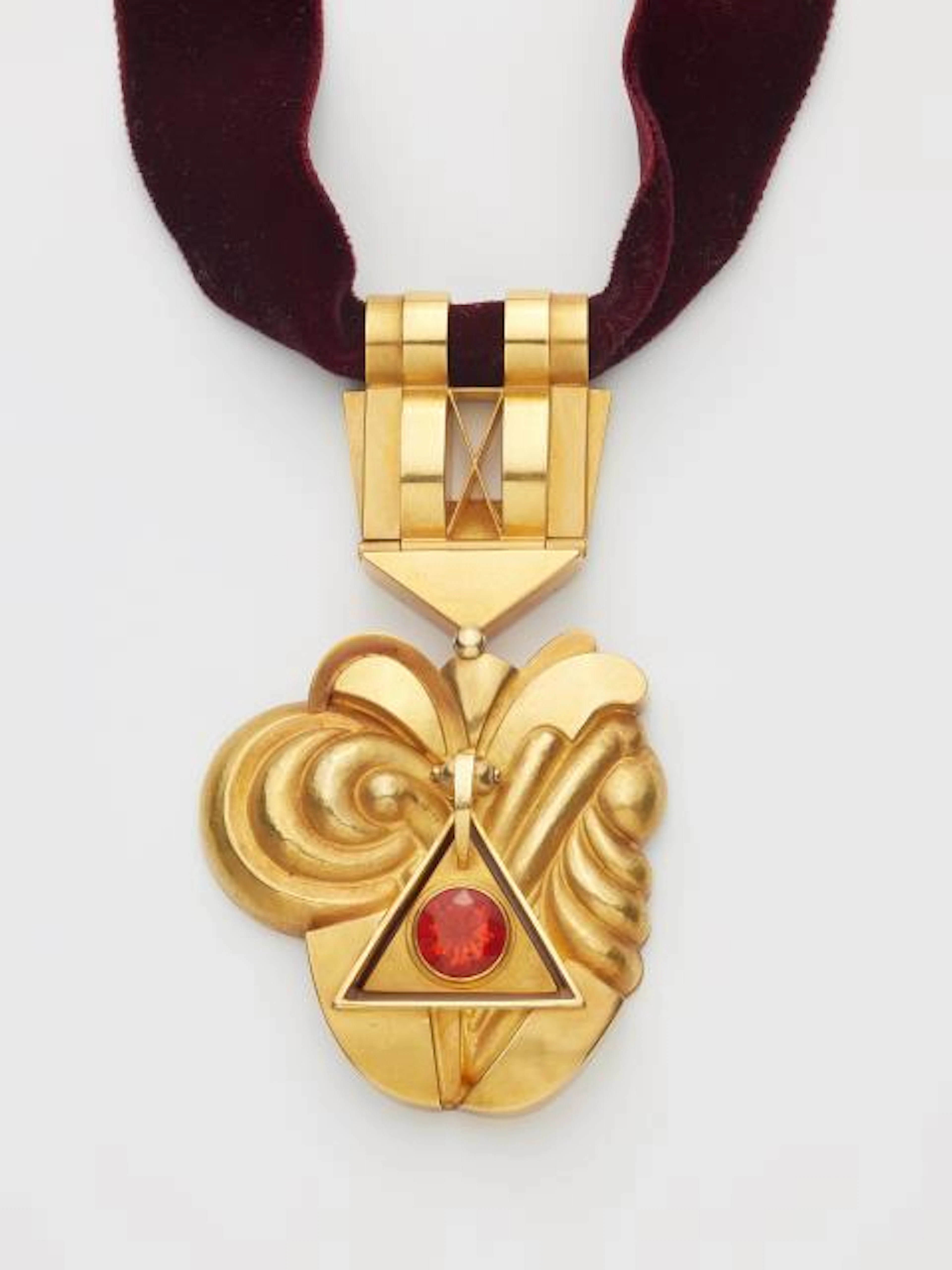 A German chased 18k yellow gold three-part pectoral pendant with a