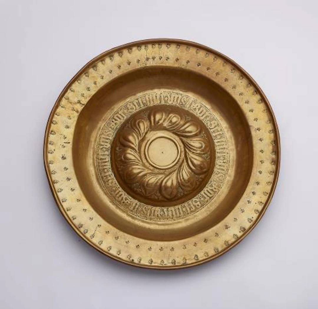 A brass 'Beckenschlägerschüssel' with a raised tracery rosette