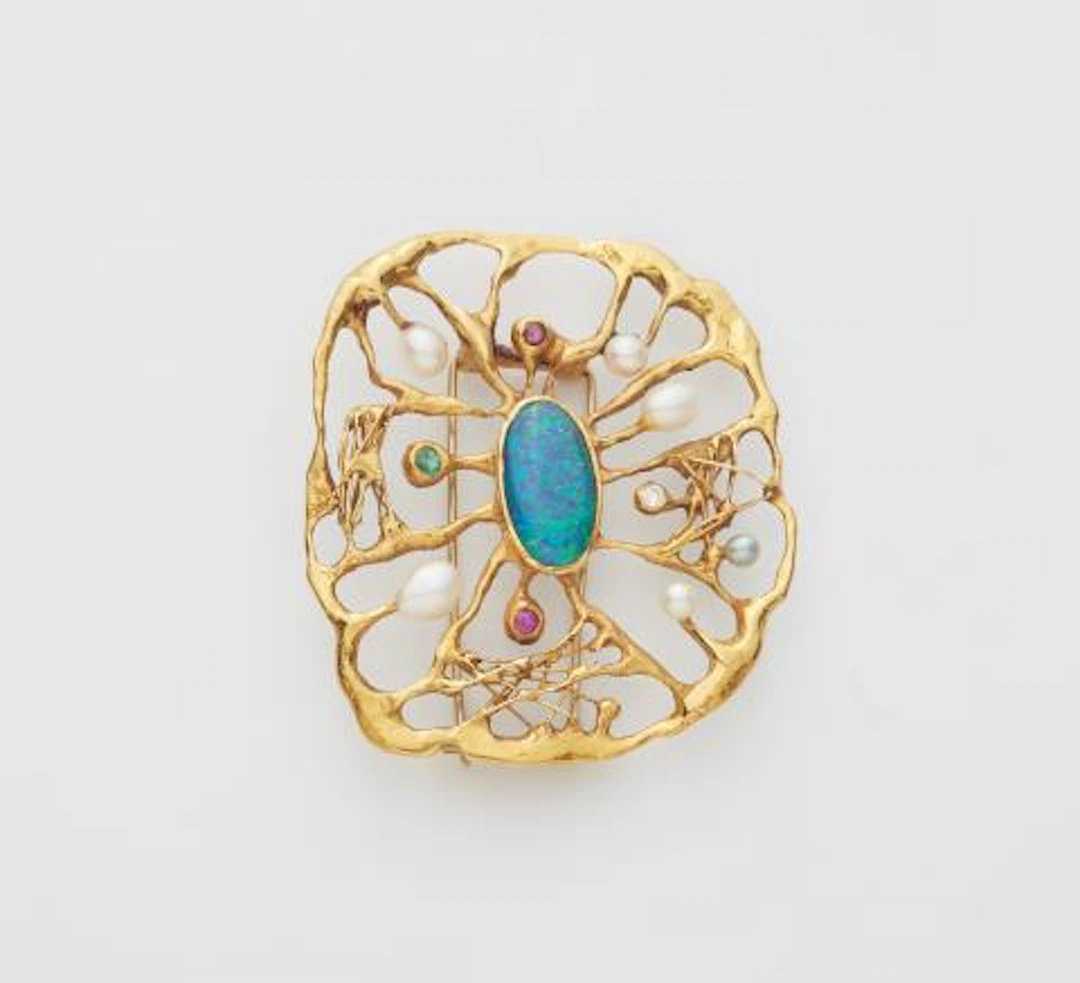 A German hand-forged 18k gold cultured pearl ruby emerald opal and