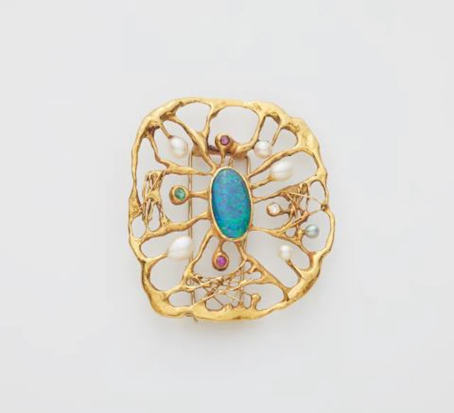 A German hand-forged 18k gold cultured pearl ruby emerald opal and