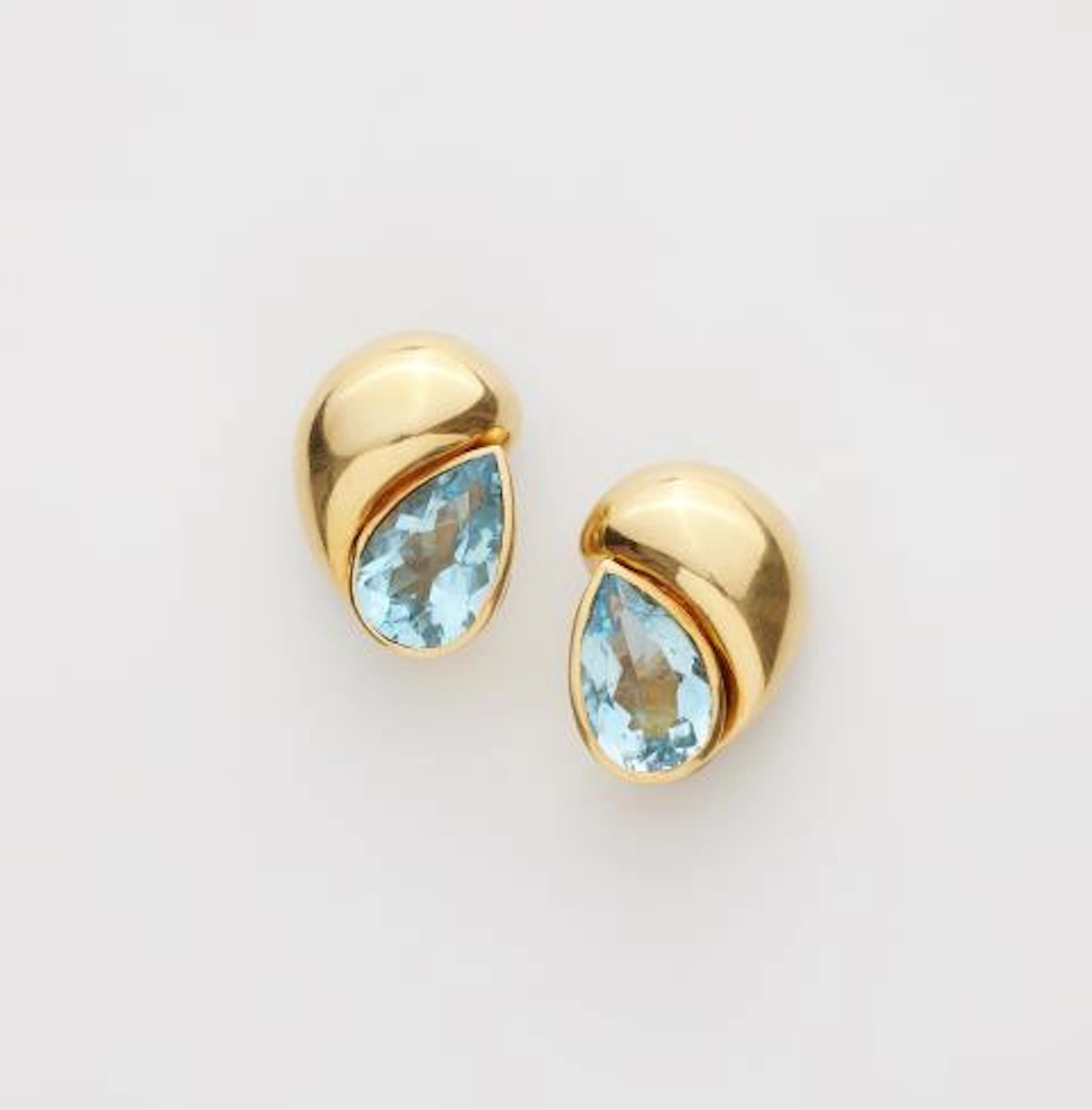 A pair of Italian 18k yellow gold and blue topaz clip earrings.