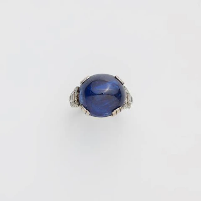 A rhodium plated 18k gold diamond and sugarloaf-cut natural Burmese