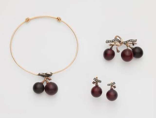 A French 18k gold silver and frosted red glass suite with grape motifs
