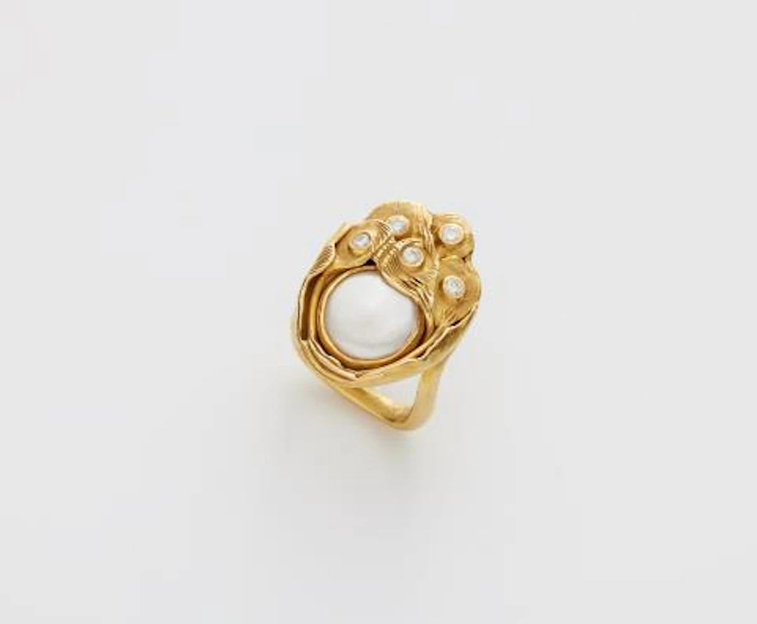 A German hand-forged 18k gold mother of pearl and diamond ring.