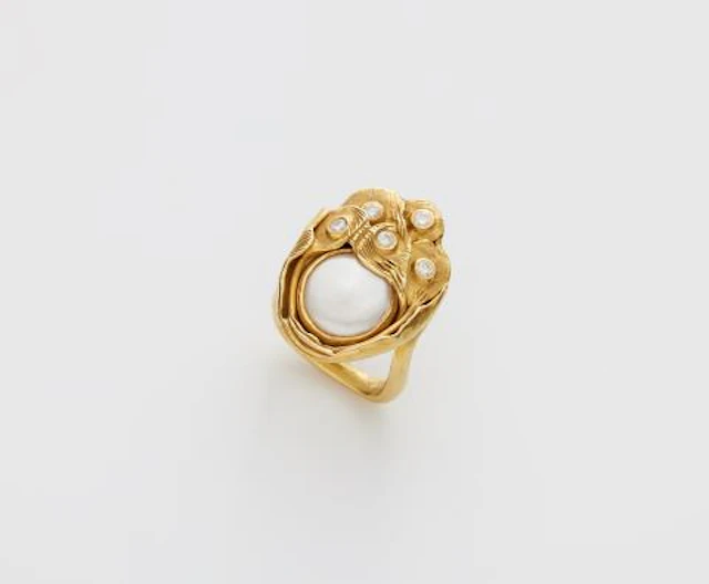 A German hand-forged 18k gold mother of pearl and diamond ring.