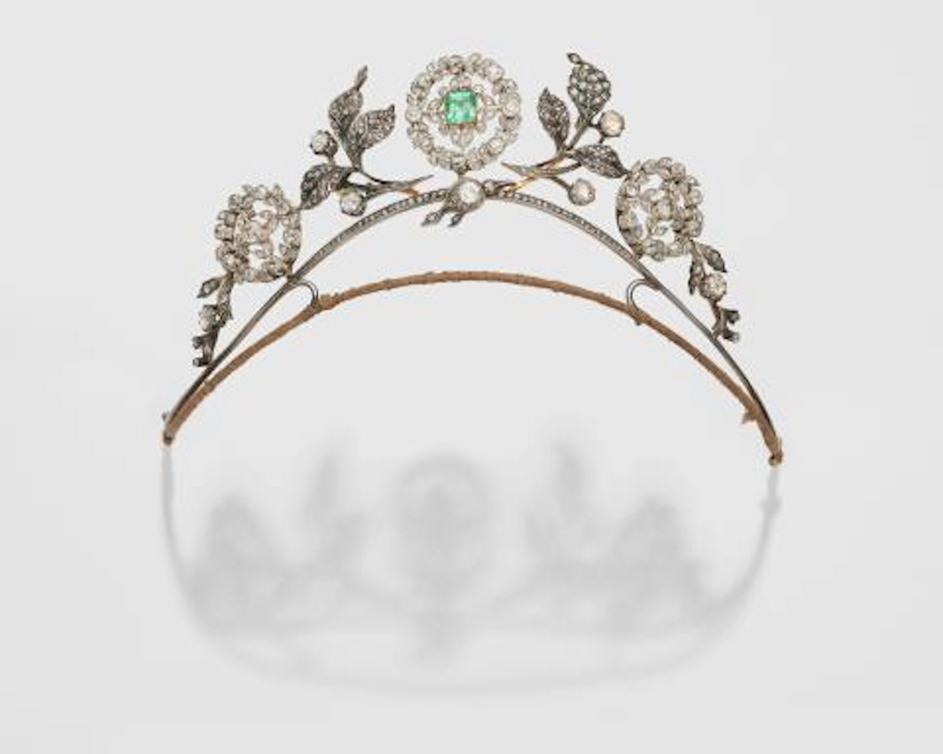 A 14k gold silver diamond and emerald Belle Epoque tiara.