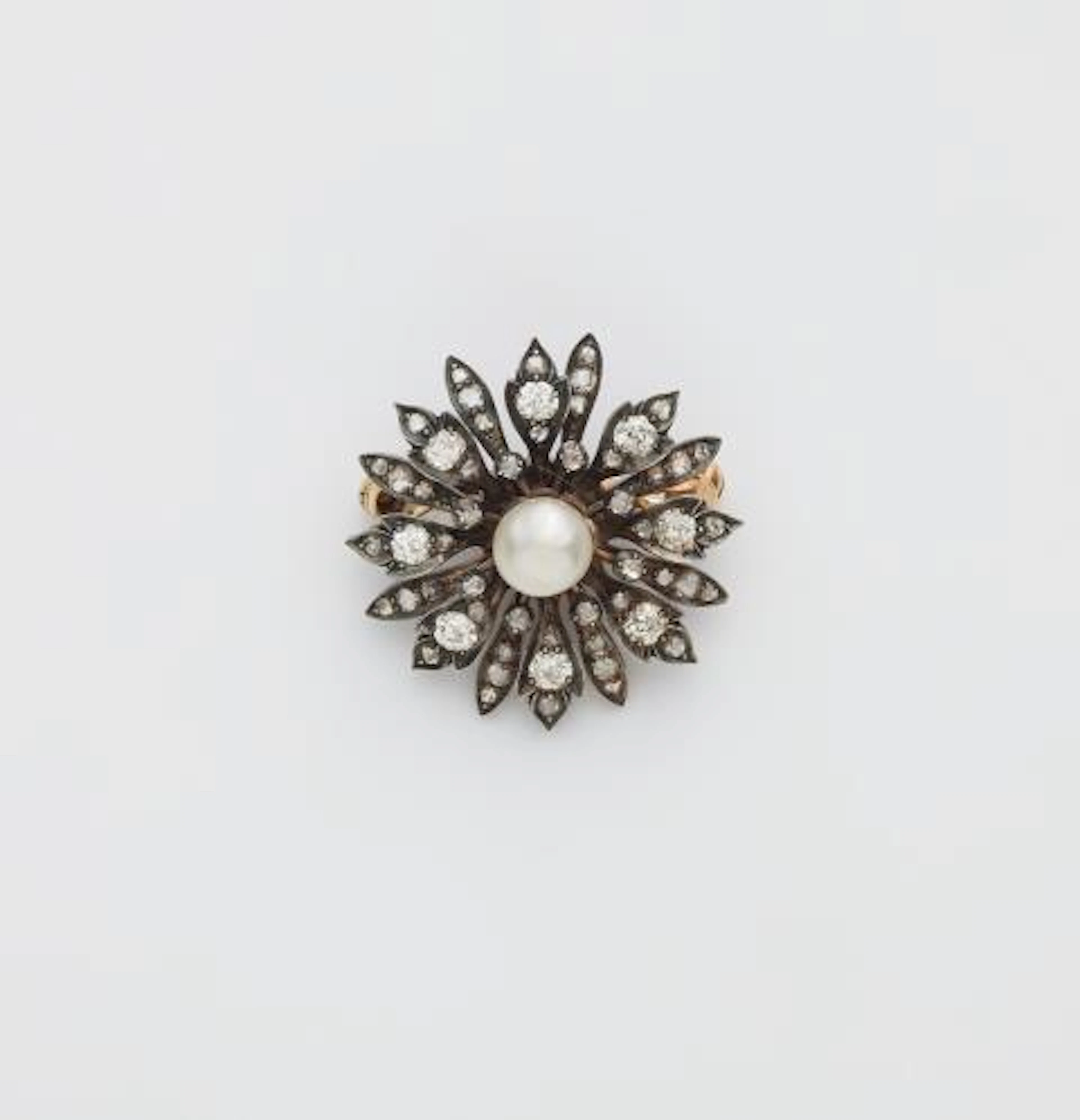 A 14k gold diamond and bouton pearl flower brooch.