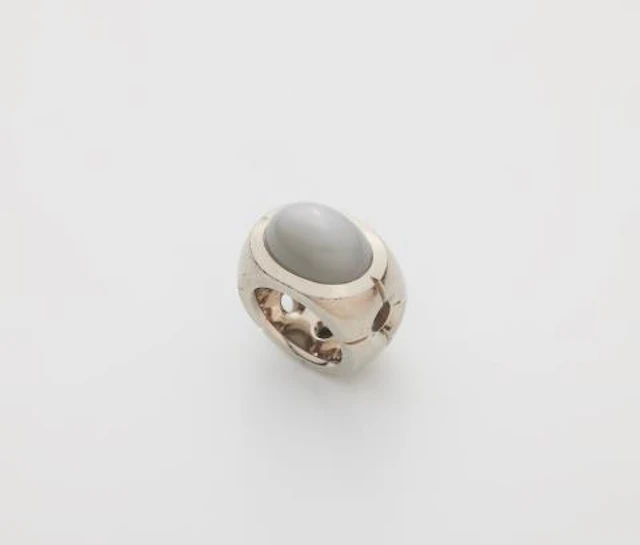 A solid 18k gold ring with a large grey moonstone.