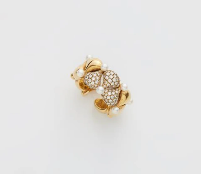 An 18k yellow gold diamond and pearl "Pushkin" flexible band ring.