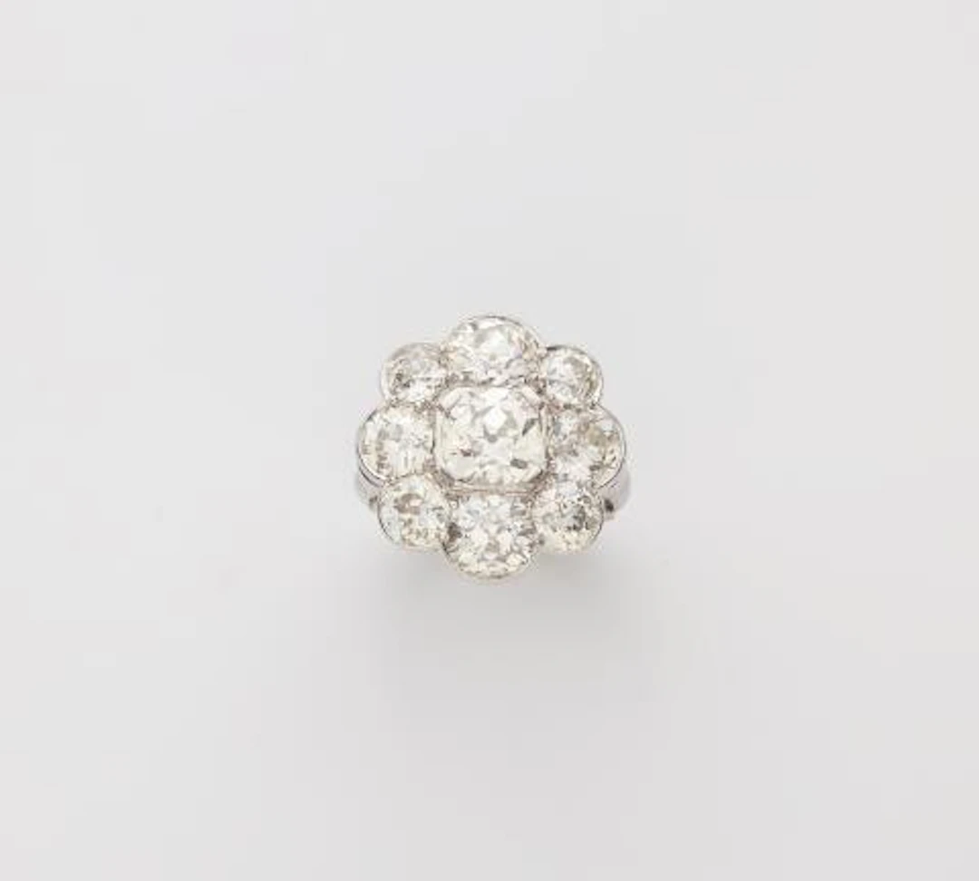 A platinum and diamond Belle Epoque Style cluster ring.