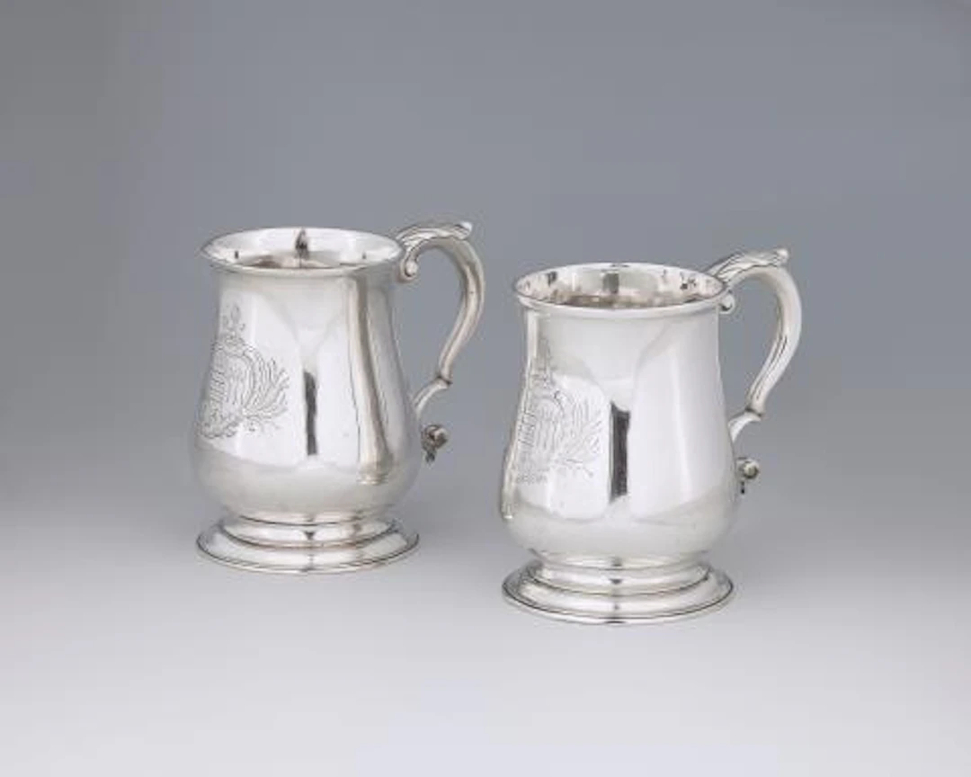 Two George II silver mugs