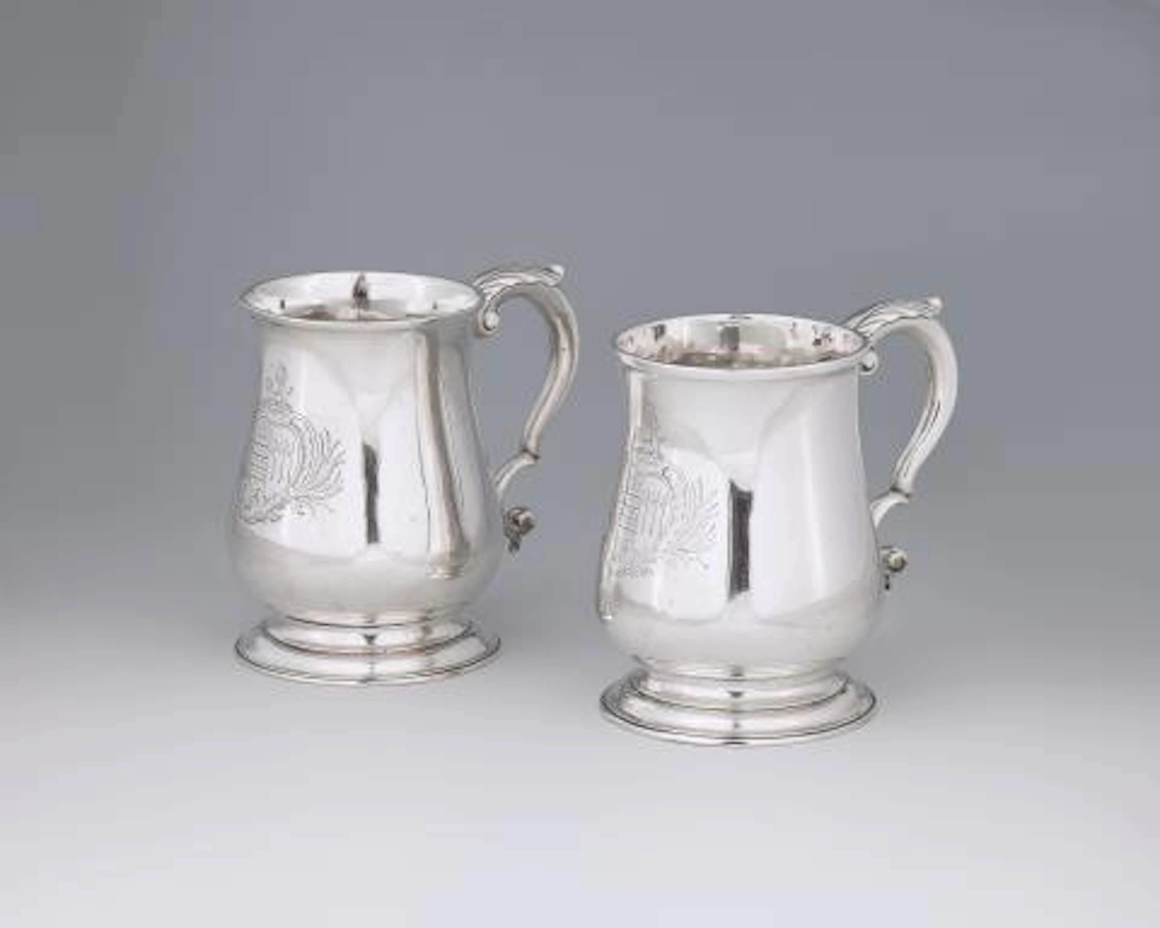 Two George II silver mugs