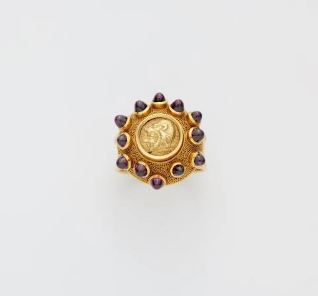 A German 18k gold granulation and almandine ring with an ancient Greek