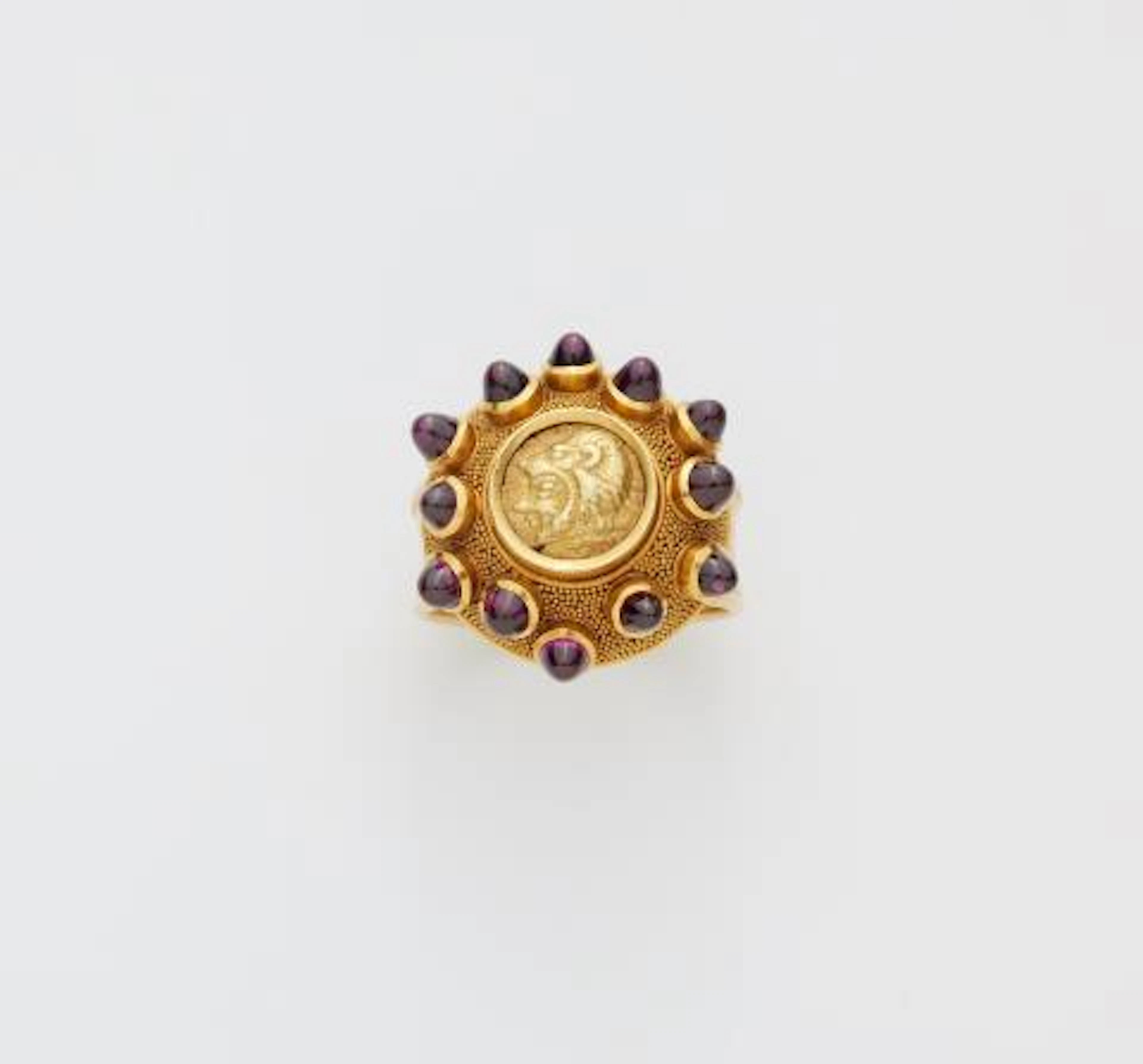 A German 18k gold granulation and almandine ring with an ancient Greek