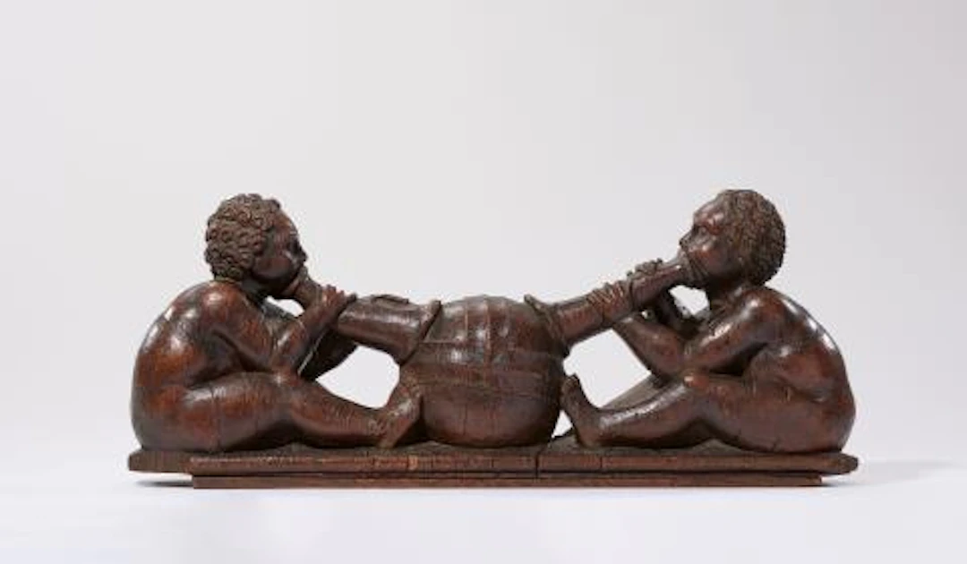 A rare carved oak group with an allegory of the wind