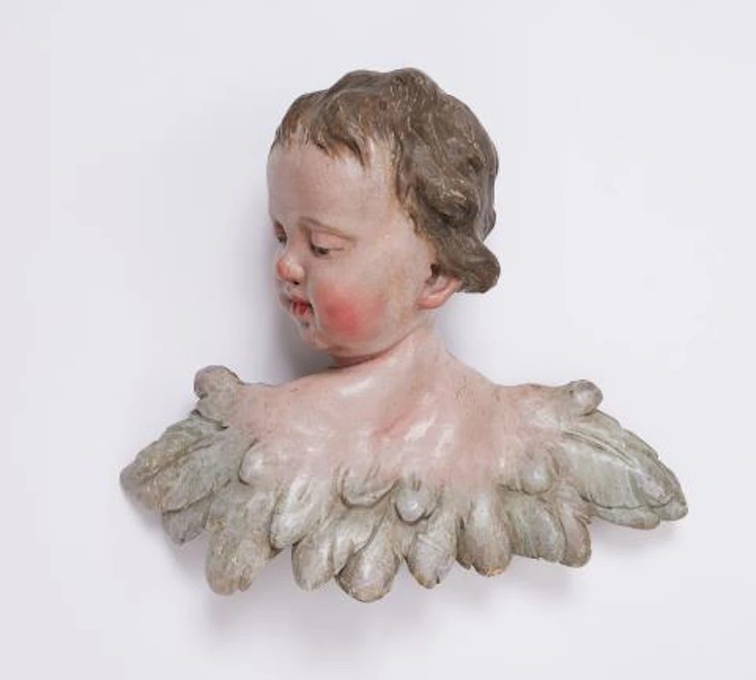 A winged angel's head