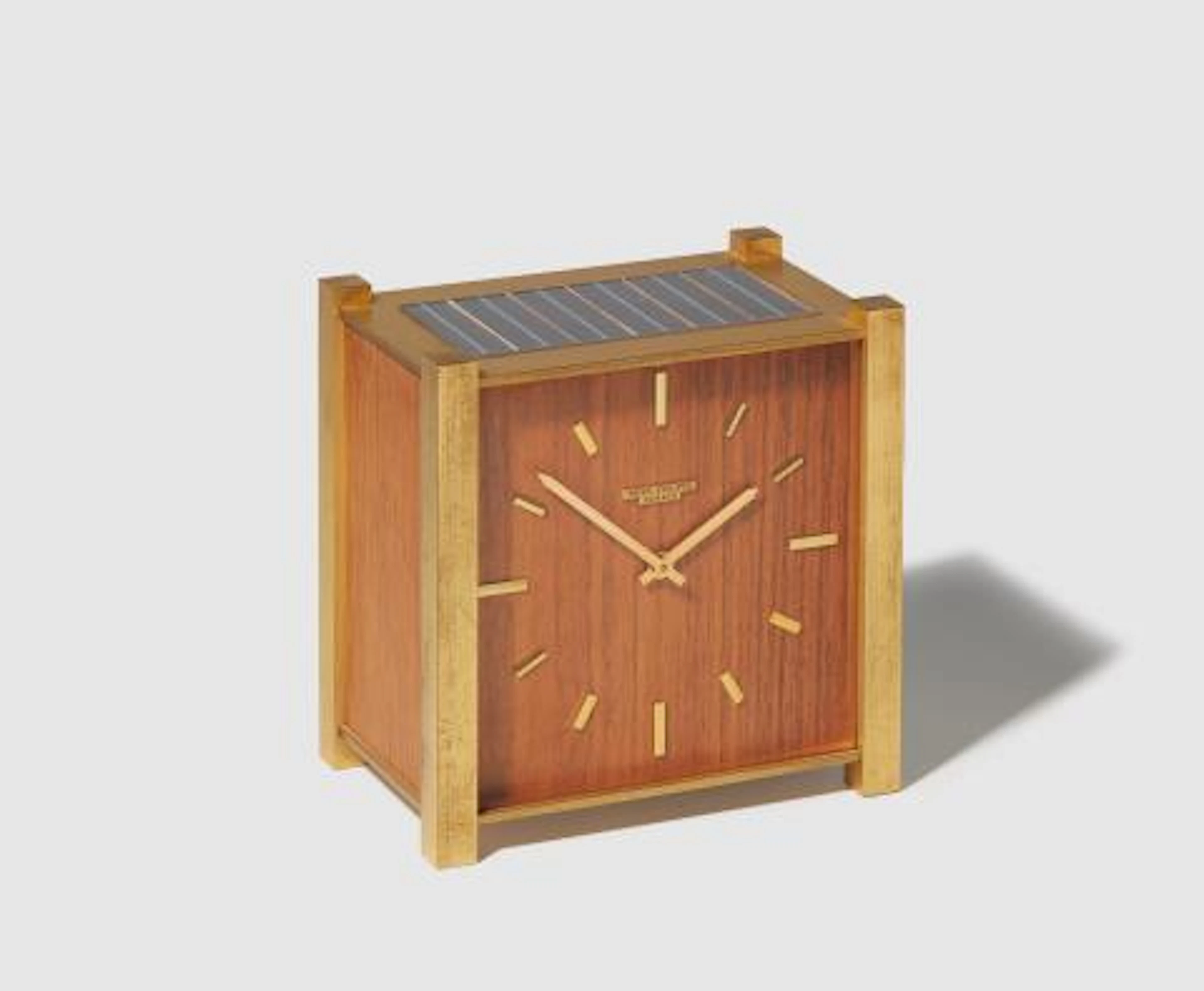 A fire-gilded brass and wood Patek Philippe Solar Table Clock
