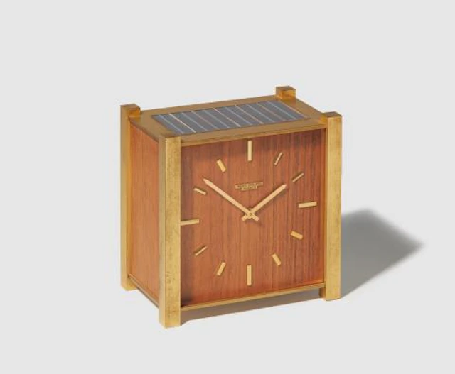 A fire-gilded brass and wood Patek Philippe Solar Table Clock